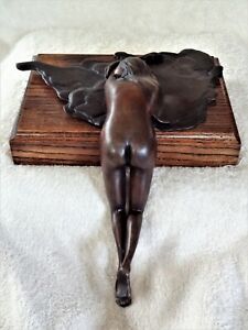 Original vintage nude woman lays on belly